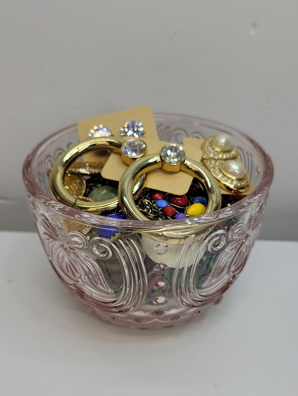 Pink Glass Dish Filled With Earrings